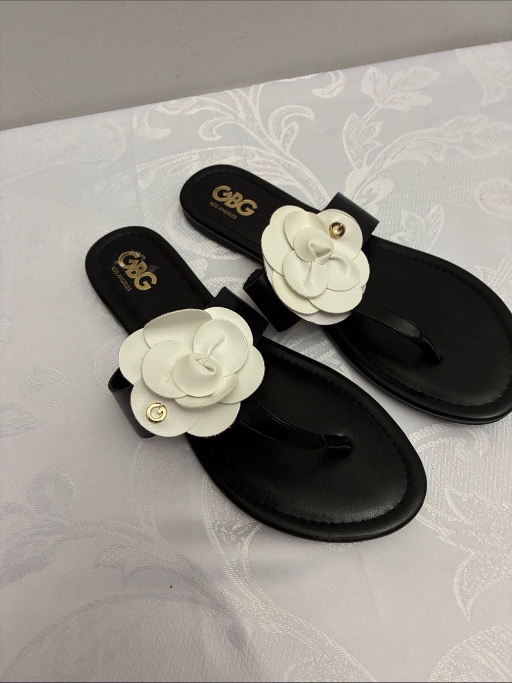 G by Guess Black Sandals with White Floral Accent